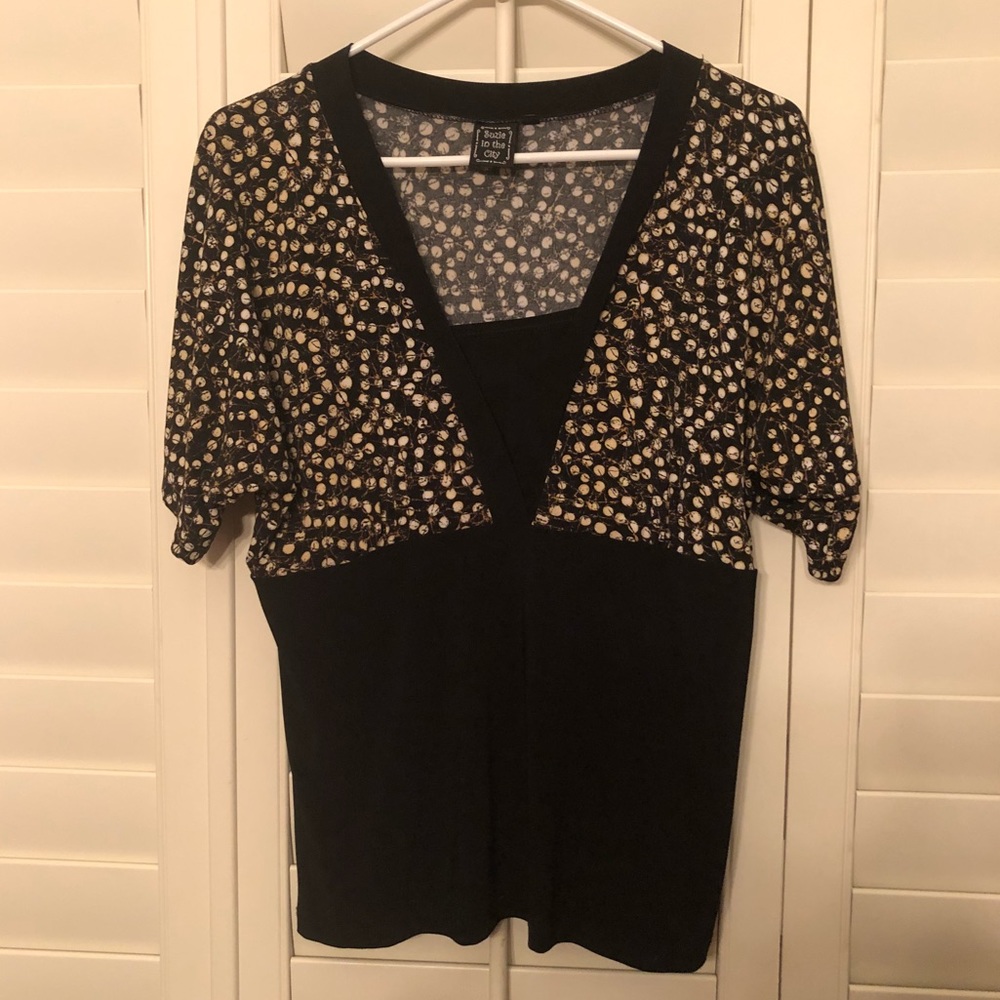 Black short sleeve top with brown polka dot design
